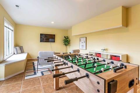 Game on! Enjoy friendly competition with foosball fun in the basement.