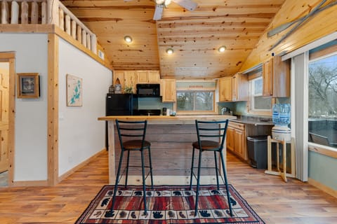 Kitchen overview w/ generous counters & clean, functional layout.