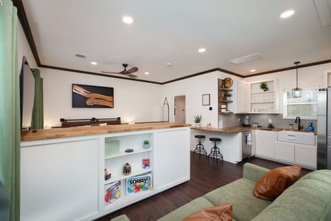 Whether it’s a movie night or a little friendly competition, the Rustic Retreat has you covered. With games, a big screen, and a space made for relaxation