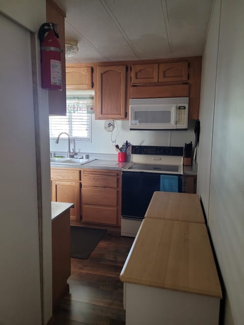 back door entrance into the kitchen and laundry is to the left, Behind sliders