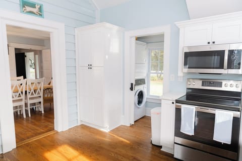 Kitchen & Laundry w/ Stacked Washer & Dryer