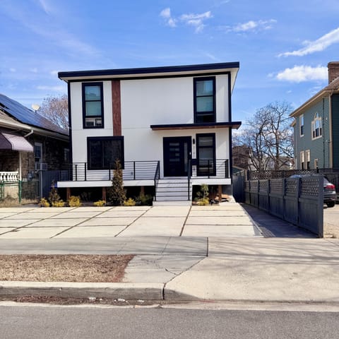 Front of the house. There is a private entrance in the back. 