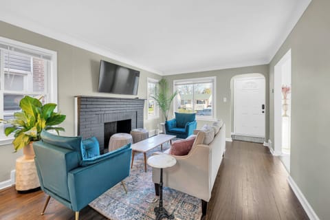 Living room with ample seating. 55" smart tv with Peacock streaming app included