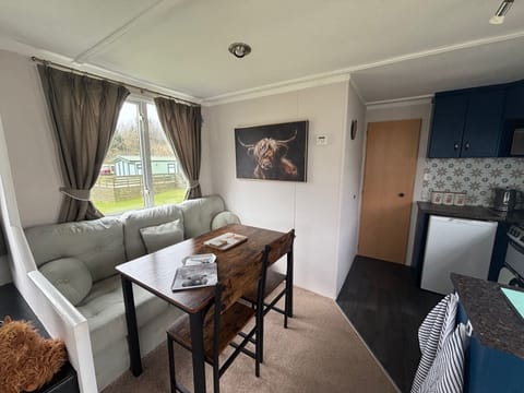 Dining table with bench seating and 2 extra chairs. 