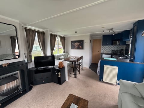 Bright and spacious living room, kitchen and dining area with plenty of seating. 