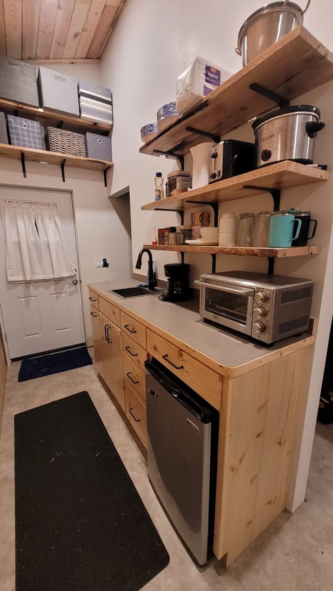Fully stocked kitchenette includes coffee, snacks, spices, etc. 