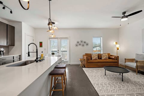 Step into a bright and airy open-concept space designed for comfort and connection. The seamless flow between the living, dining, and kitchen areas creates a welcoming atmosphere, perfect for relaxing!