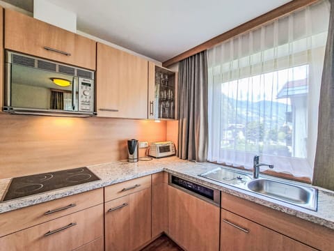 Interior Design, Flooring, Furniture, Floor, Room, Home, Cabinetry, Ceiling, Countertop, Apartment