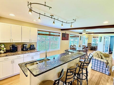 Gather for dinners or game nights in the roomy dining area, with comfy seating nearby for movie marathons or casual conversations.

