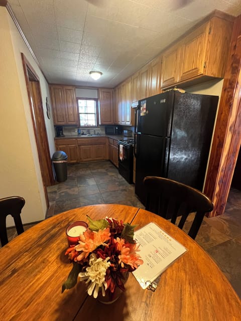 Table and 4 chairs inside kitchen 