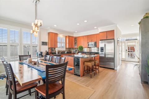 Your gourmet kitchen invites culinary adventures with sleek appliances, granite counters, and a breakfast bar perfect for morning coffee.