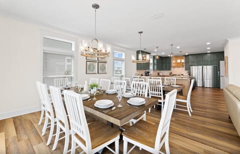 Gather around this beautiful dining table where memorable meals unfold. The open-concept design flows seamlessly into your modern kitchen space.