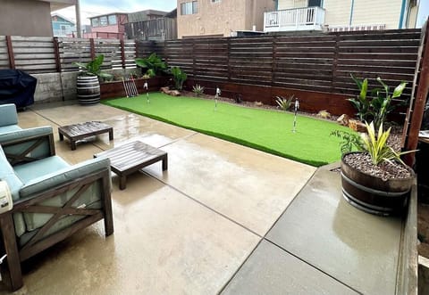 Backyard mini golf, propane bbq and outdoor shower to wash the sand away.