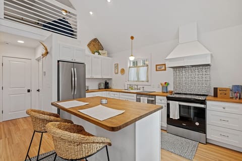 Modern kitchen stocked for weekend stays or longer visits.