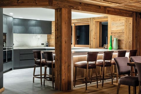 Kitchen with marble island and 6 leather seats