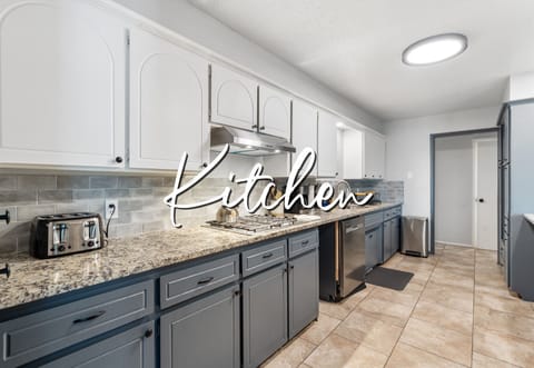 Bright and airy kitchen with modern appliances and ample counter space.