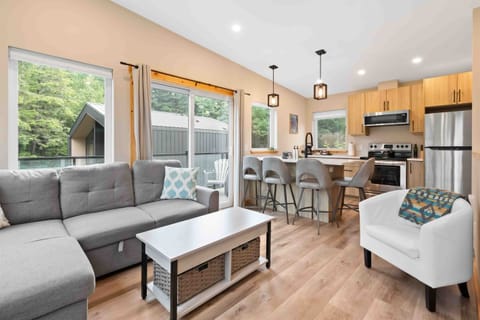 Living Room: Bright and airy space with sleek furnishings, perfect for unwinding after a day of exploration!