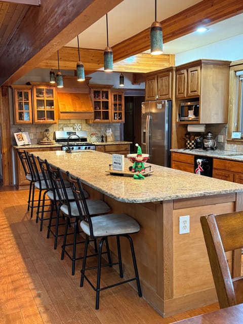 This island has ample seating for 5 and room for several to be in the kitchen