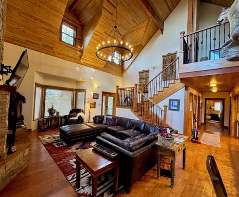 Step into the great room, the heart of Grinning Bear Lodge.