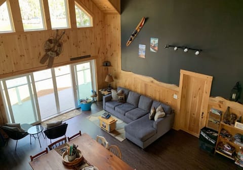 Inviting living room with large windows and lake views.