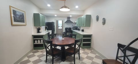 The leaf for the dining table is in the laundry room. It seats 5.