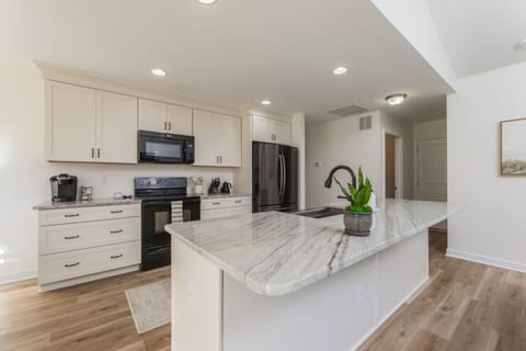 Prepare meals with ease on the elegant marble island.