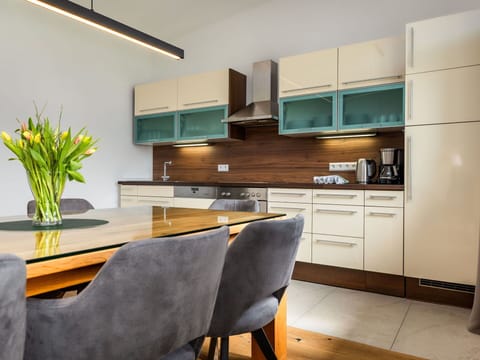 Furniture, Interior Design, Flooring, Wood, Countertop, Cabinetry, Kitchen, Light Fixture, Floor, Chair