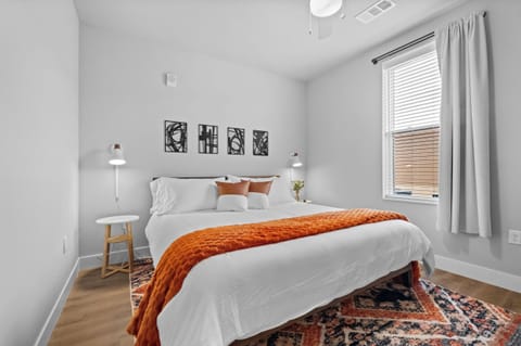 Your Master Suite, a Luxurious Haven Designed For Ultimate Relaxation. Featuring a Plush King-Size Bed Adorned with Soft, Comfy Blankets. This Spacious Retreat Invites You to Unwind and Recharge. A Calming Ambiance for a Restful Night's Sleep.