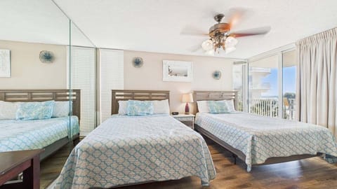 Two queen beds with balcony access and gulf views