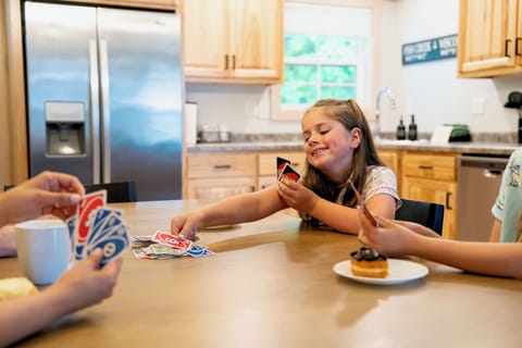 Enjoy games with the family at the large dining table.