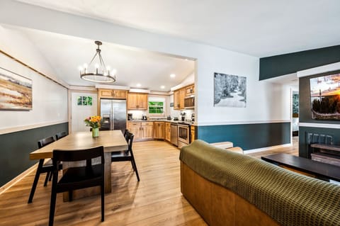 View of the open concept kitchen, dining, and living room areas.