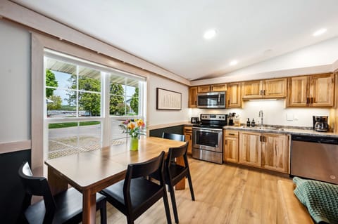 Full kitchen equipped with fridge, oven, microwave, and dishwasher.