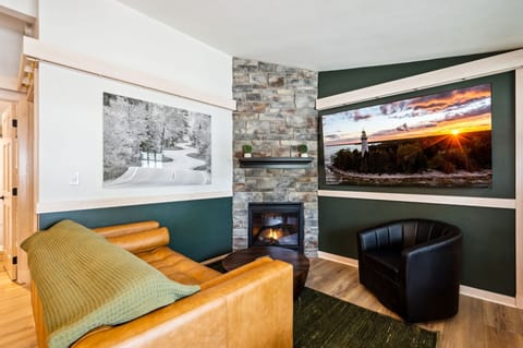 Cozy Living room with massive 75-inch smart TV and gas fireplace