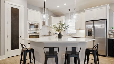 Enjoy making delicious meals in the chef's kitchen, complete with a huge island