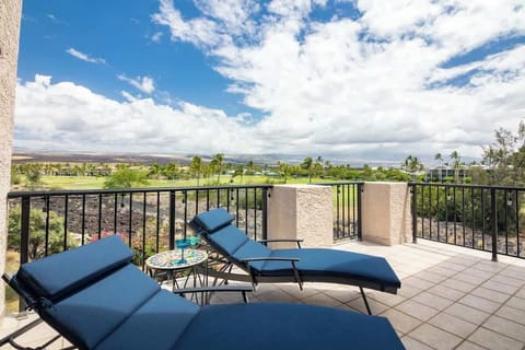 Spacious lanai with seating, offering beautiful views of the lush surroundings and direct access to the nearby tennis courts.