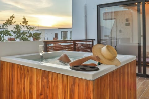 Private rooftop spa with panoramic sunset views — your serene escape awaits. 