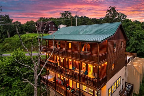 Top floor: 4 bedrooms, middle: 2 bedrooms, bottom: hot tub, pool, game, theater