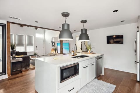 Island featuring Cast Iron Sink, Microwave, DW, & Outlet for your Power Needs.