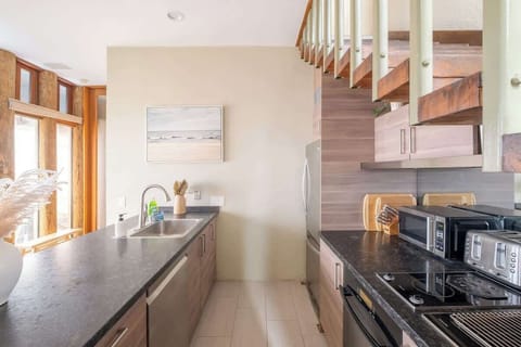 The open, galley-style kitchen comes fully equipped for a long or short stay