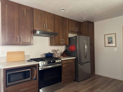 Brand new kitchen with 5-burner LP gas stove, refrigerator w/ice maker in the freezer and microwave. Griddle burner is great for pancakes or making smash burgers or warming tortillas! Make it happen w/the griddle in the drawer under the oven.