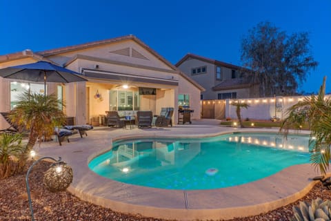 Stunning one story, 3 BR, 2 BA home with heated pool, putting green, 2 fire pits, covered patio with TV and 2 bikes.