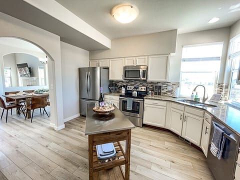 The kitchen is stocked with everything you need to prepare your meals. We have a fridge, electric stove, microwave