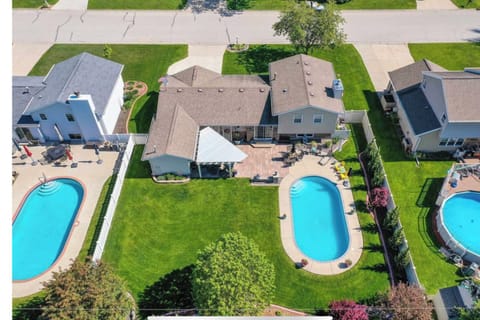 Overhead view, hot tub is on left side of backyard
