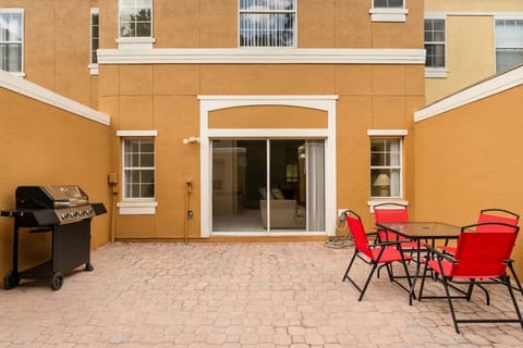Refreshing outdoor patio with BBQ grill and outdoor seating