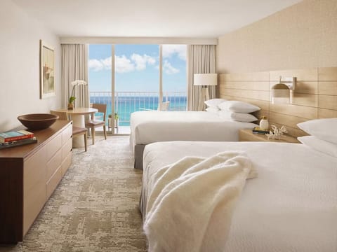 Wake up refreshed in crisp linens beside calming ocean views