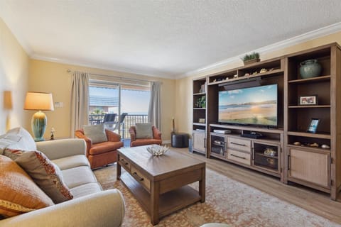 Living room with natural light from these sliding doors
