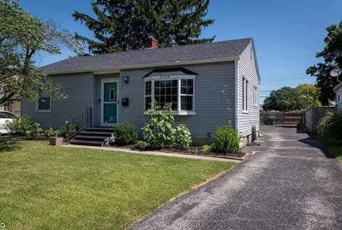 Front of home featuring long private driveway