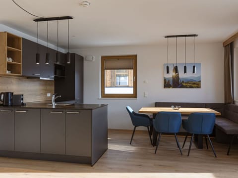 Furniture, Interior Design, Flooring, Wood, Floor, Table, Ceiling, Kitchen & Dining Room Table, Light Fixture, Wood Flooring