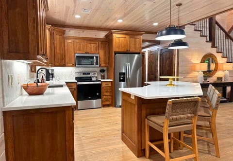 Whether you're preparing a family feast or grabbing a quick snack, this open-concept kitchen offers the perfect space to gather.