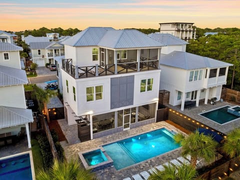 Bougie Buffalo - Sleeps 28! Private gated beach access just steps away and FREE golf cart included! Private backyard oasis with heated pool, hot tub, lounge chairs, hammocks, outdoor dining table, and screened in outdoor kitchen and lounge area.